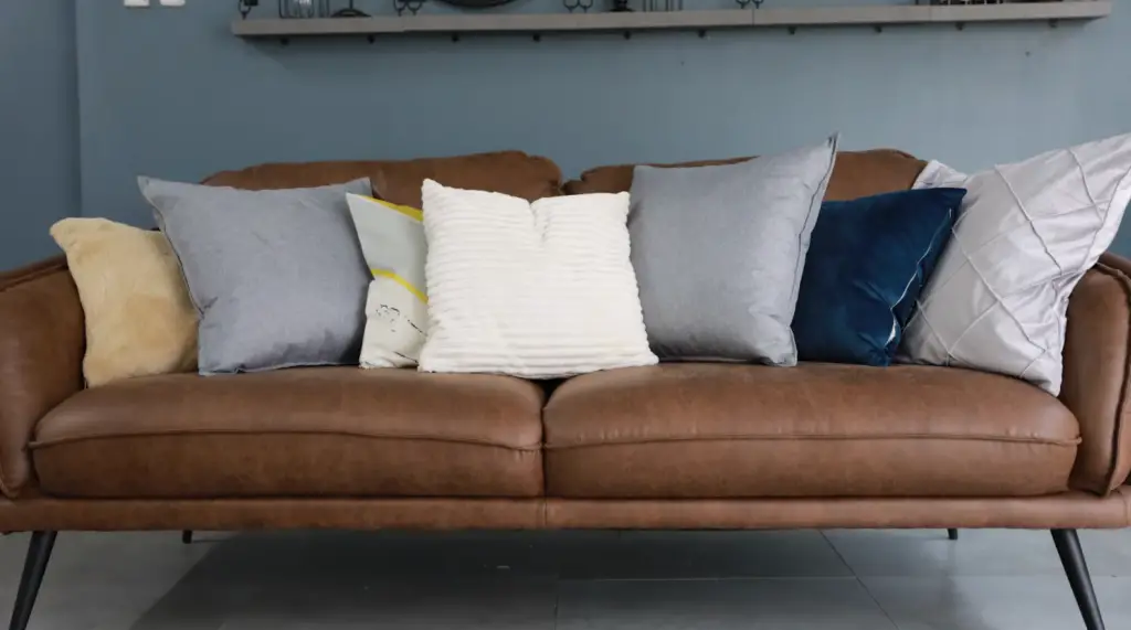 How do you accessorize a brown sofa?