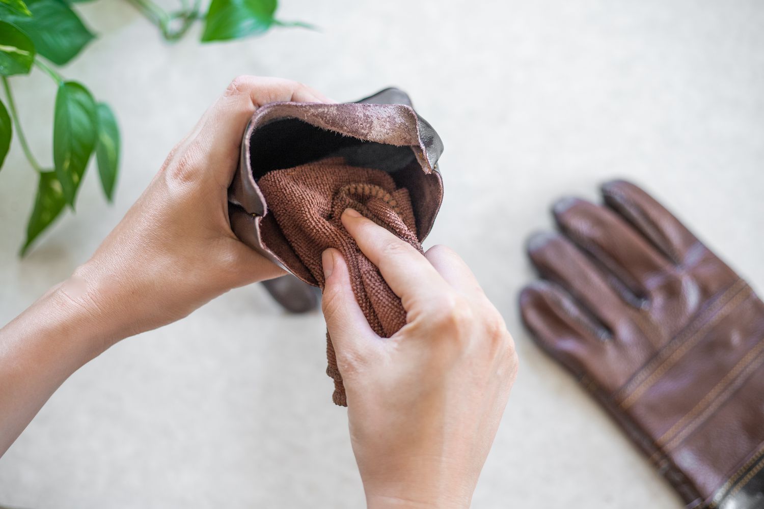 How do you clean and treat leather gloves