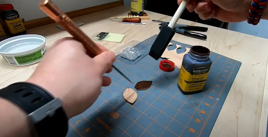 How do you cut leather into a leaf shape?